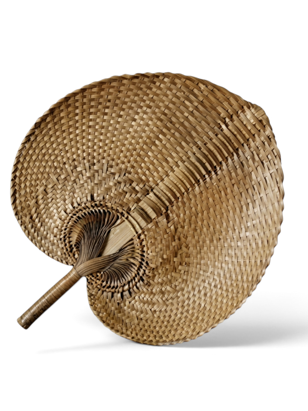 AYOMI large hand-woven palm leaf fan with a natural wicker texture, suitable as a decorative wall hanging.