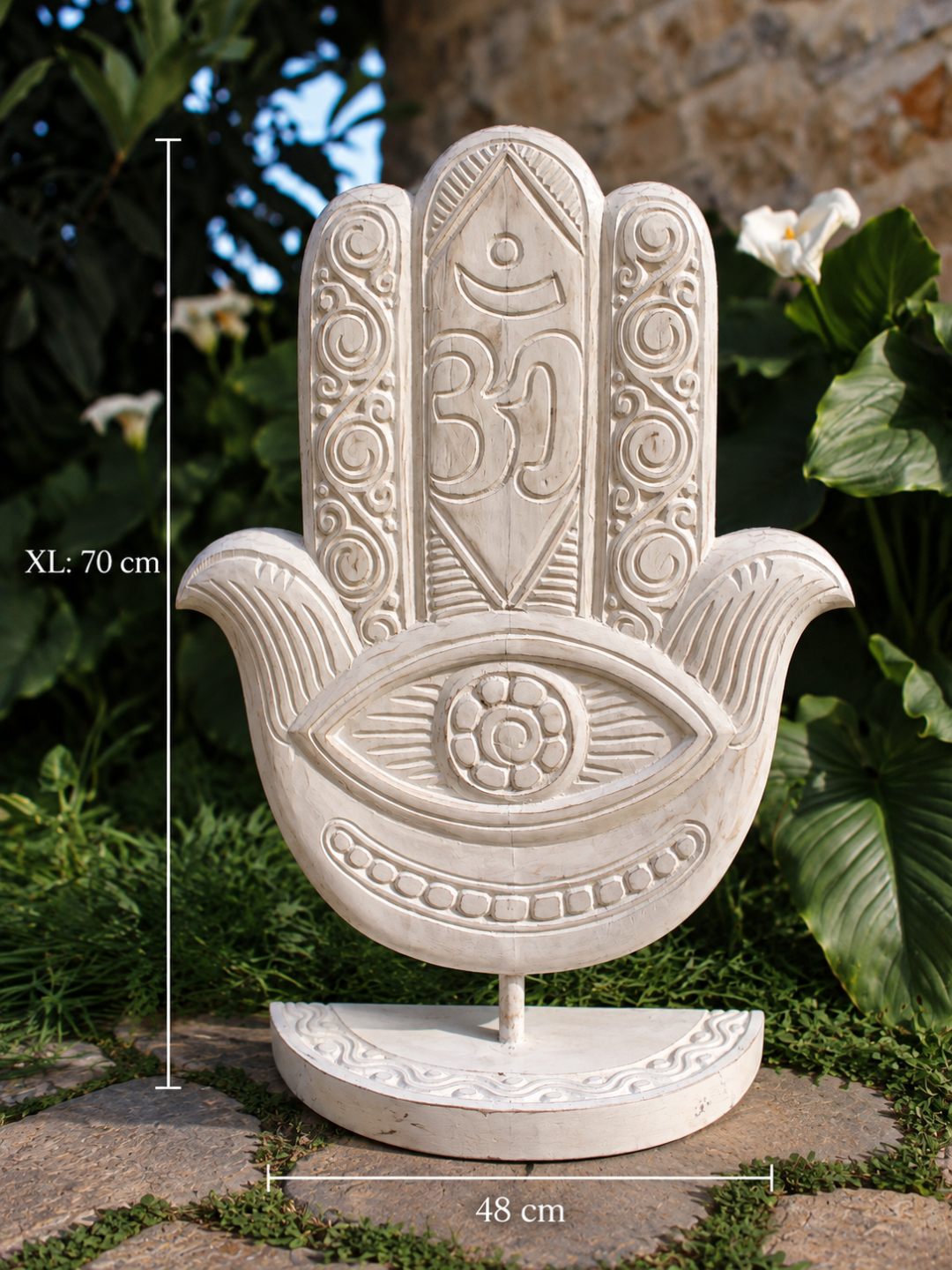 AYOMI white hand-carved wooden Hamsa hand sculpture with Om symbol and eye detail on a stand for home decor