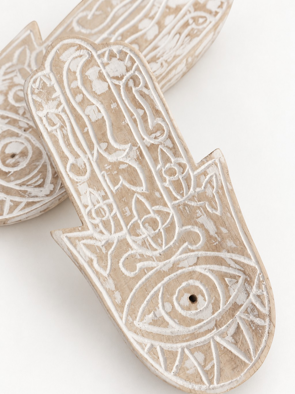 AYOMI hand-carved balsa wood Hamsa incense holder with white painted eye detail and intricate floral patterns
