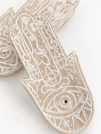 AYOMI hand-carved balsa wood Hamsa incense holder with white painted eye detail and intricate floral patterns