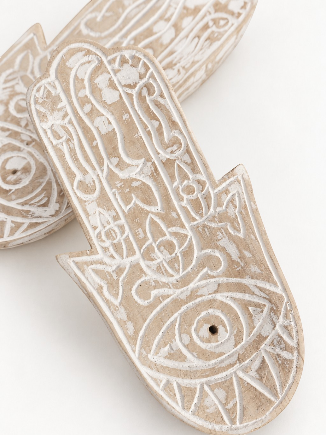 AYOMI hand-carved balsa wood Hamsa incense holder with white painted eye detail and intricate floral patterns