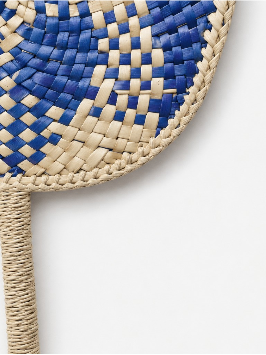 AYOMI Osaka hand fan made of woven blue and natural palm leaves with a decorative handle