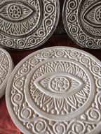 AYOMI set of two white hand-carved solid wood wall plates featuring intricate evil eye and floral patterns
